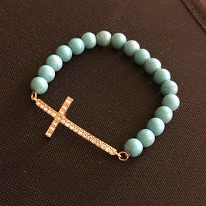 Beaded bracelet with cross statement